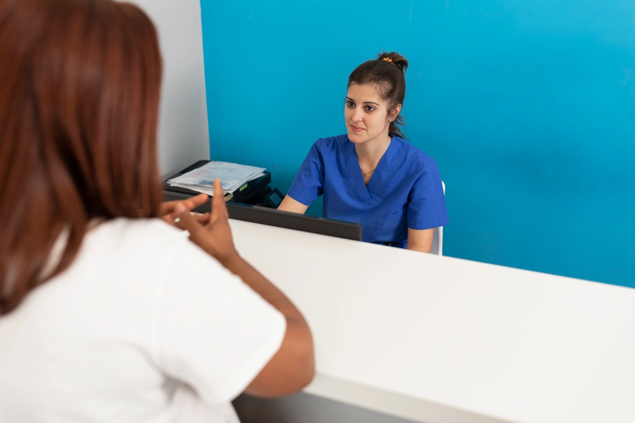 Dentist consulting with a patient in a modern clinic